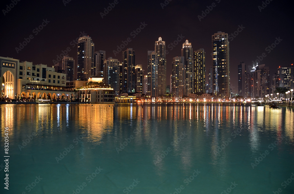 Obraz premium city building at night and water reflect photo