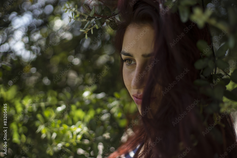 girl with straw hat in a park in spring girl with straw hat in a park in spring