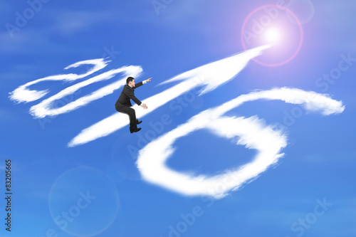Man riding 2016 arrow up shape clouds in sunlight sky