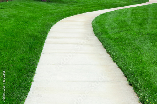 Pathway through green lawn