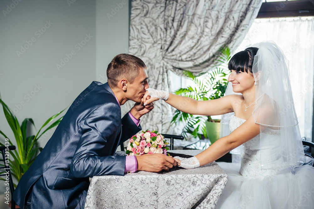 Fototapeta premium Charming bride and groom on their wedding celebration in a