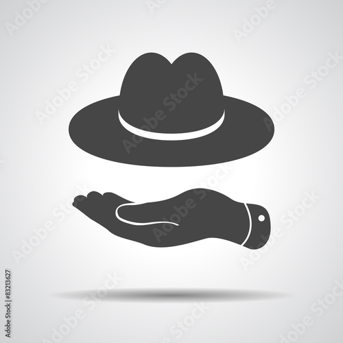 flat hand showing black hat icon on a grey background