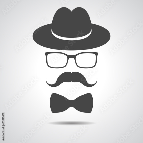 black hat with mustache, bow tie and glasses isolated on a grey