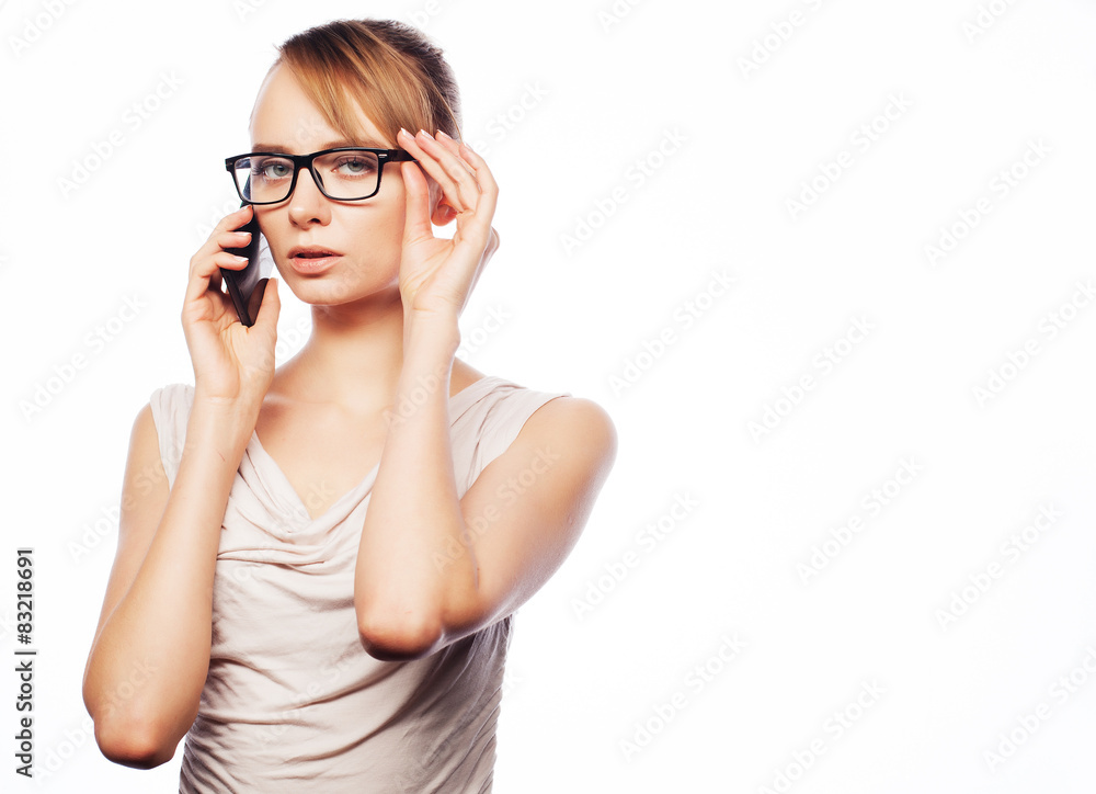 Young business woman calling by phone