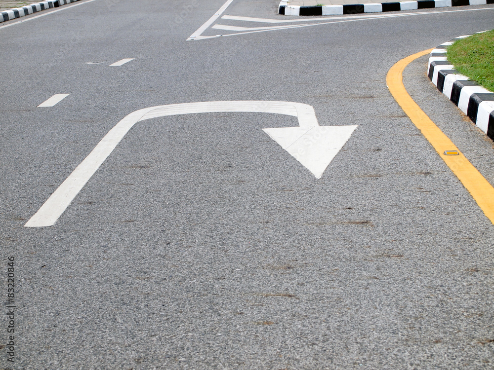 Arrow signs as road markings on a street Arrow signs as road markings on a street
