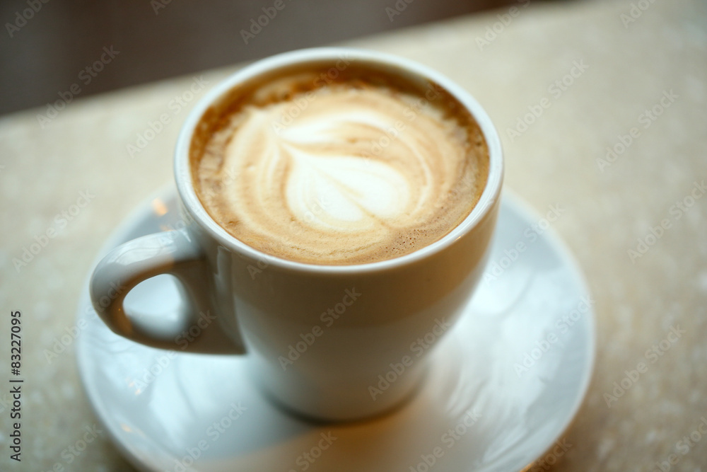 Fototapeta premium Cup of coffee on table close up