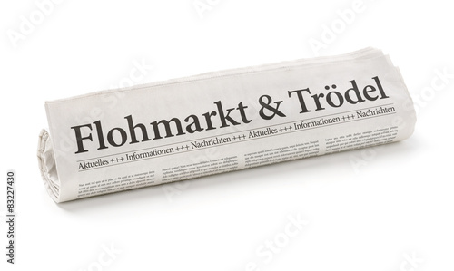 Zeitungsrolle mit der   berschrift Flohmarkt und Tr  del