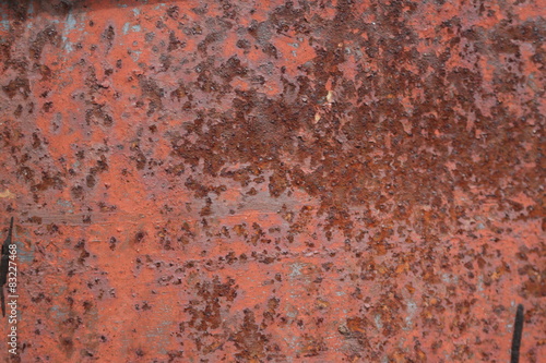 scratched and rusty orange metal surface