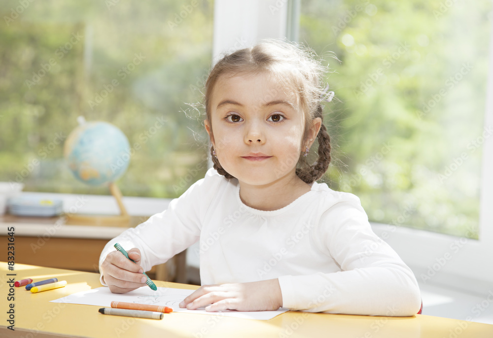 Preschooler girl drawing with pencils Preschooler girl drawing with pencils