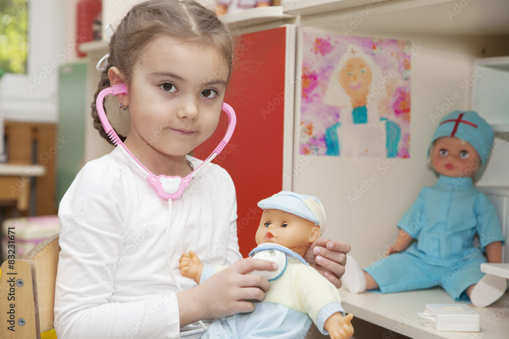 Caucasian little girl playing doctor Caucasian little girl playing doctor