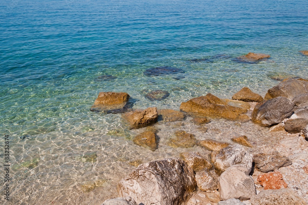 Beautiful beach with big stones in Podgora, Croatia Beautiful beach with big stones in Podgora, Croatia