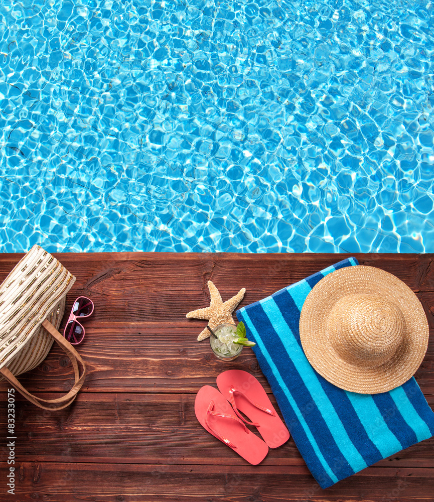 Fototapeta premium Swimming accessories on wooden mole