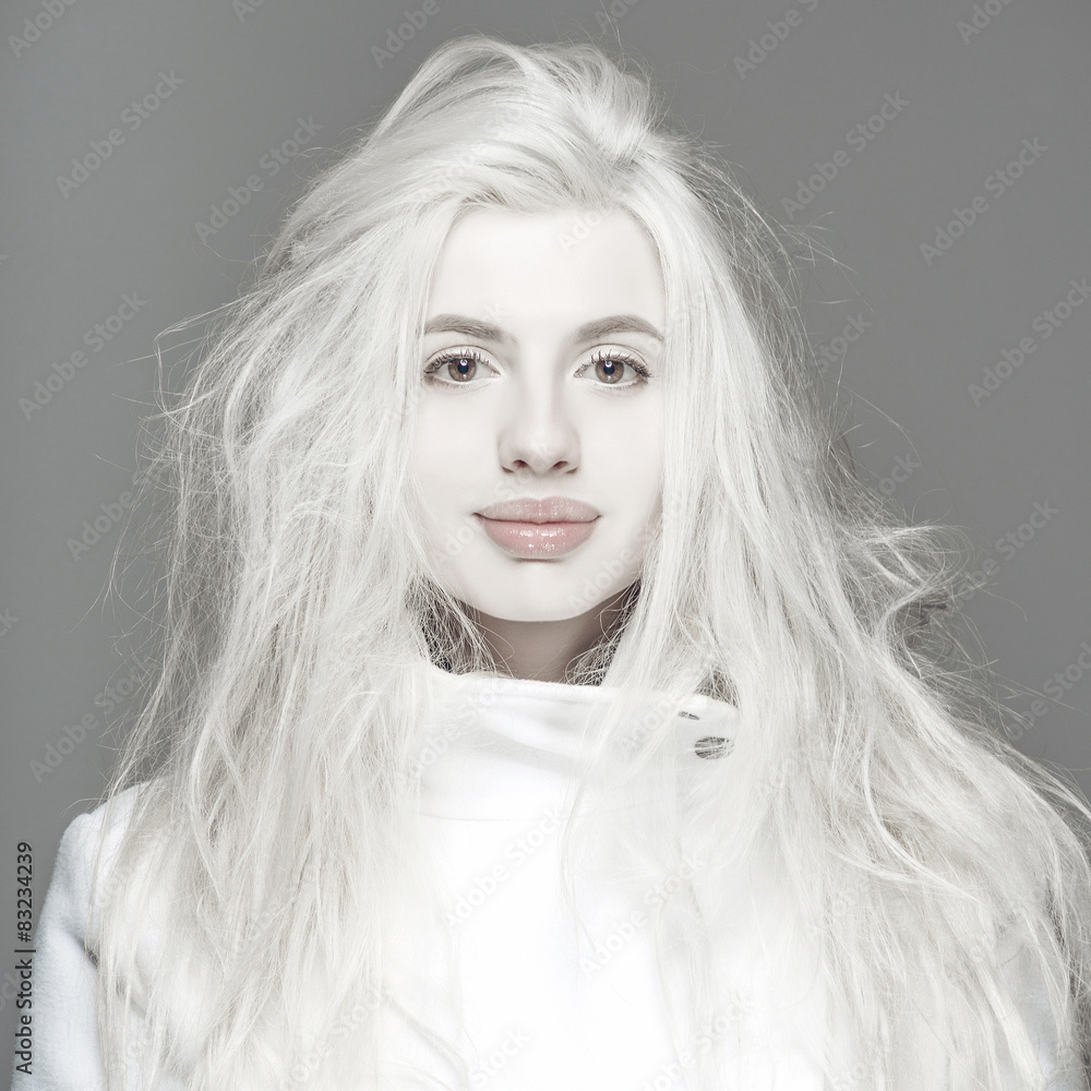 Fototapeta premium Blonde fashion woman sexy natural lips posed on blue background 