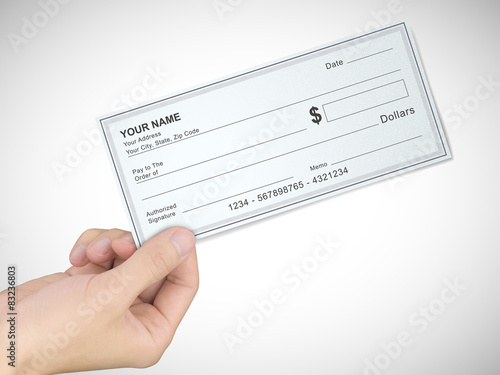 business concept: man's hand holding a check
