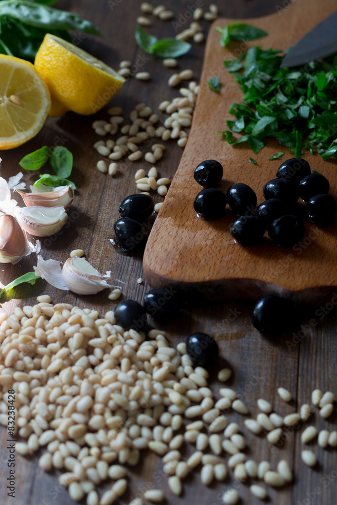 Fototapeta premium pesto preparation ingredients basil, garlic, lemon, pine, olives