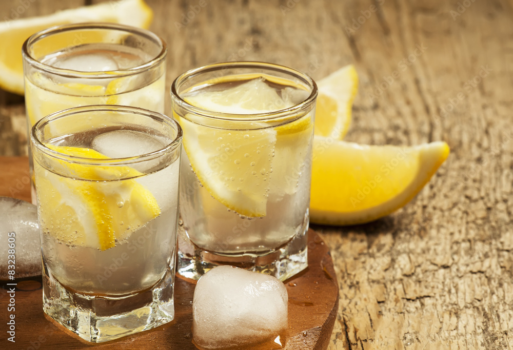 Refreshing cocktail with lemon and ice, selective focus Refreshing cocktail with lemon and ice, selective focus