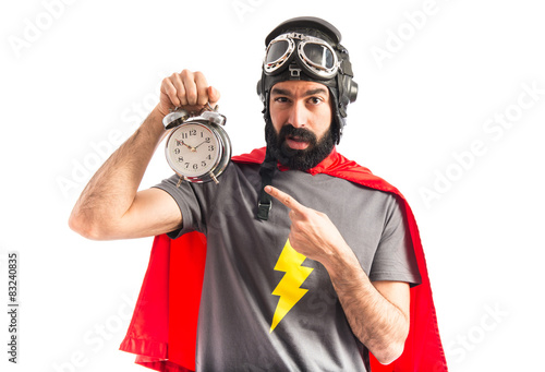 Super hero holding vintage clock