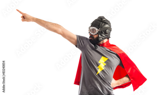 Super hero pointing to the lateral
