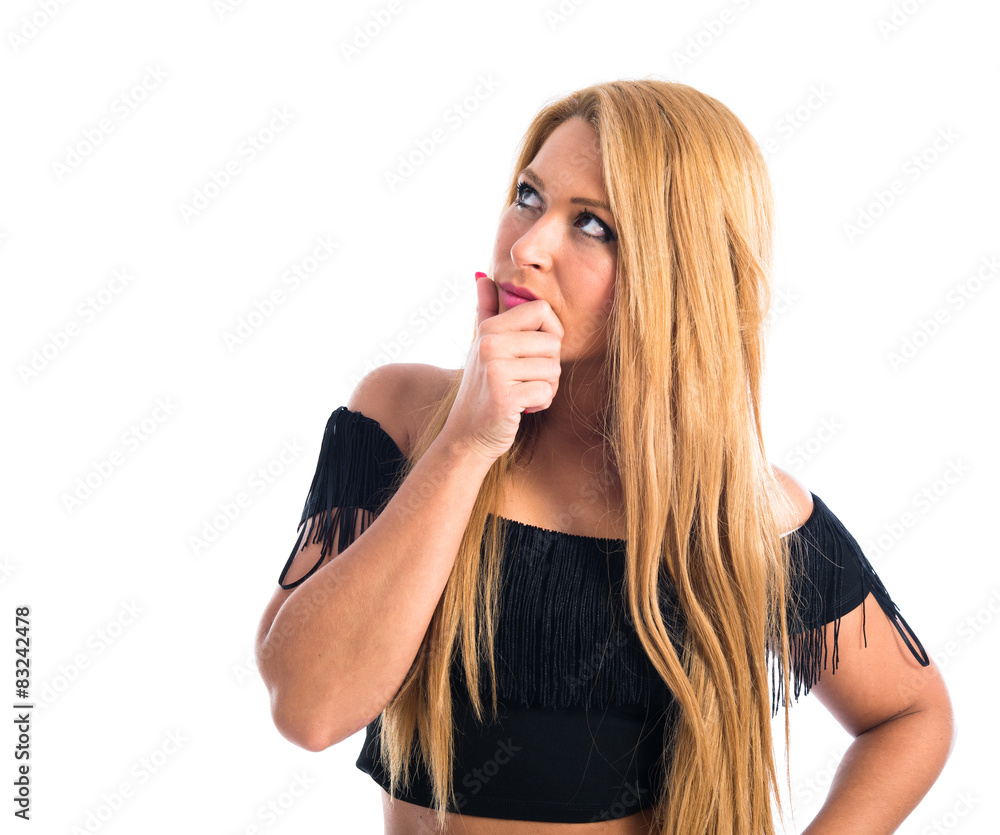 Girl thinking over white background Girl thinking over white background
