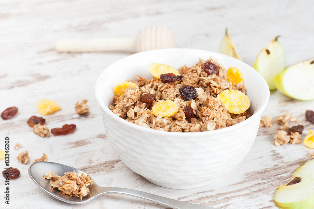 homemade granola in a bowl and spoon homemade granola in a bowl and spoon