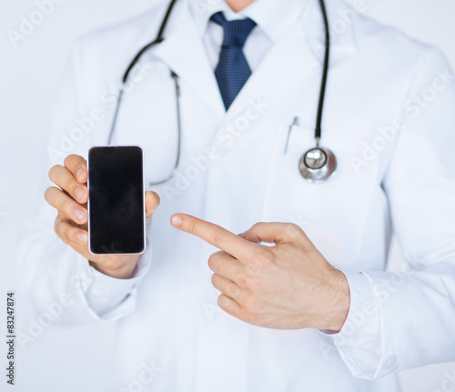 doctor pointing at smartphone