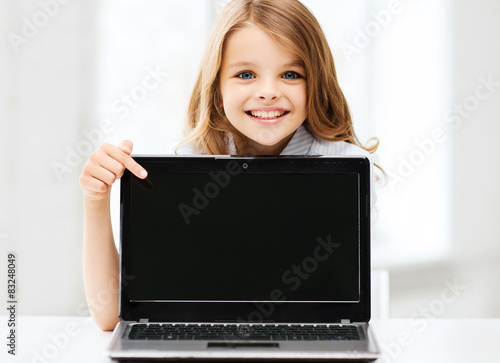 girl with laptop pc at school