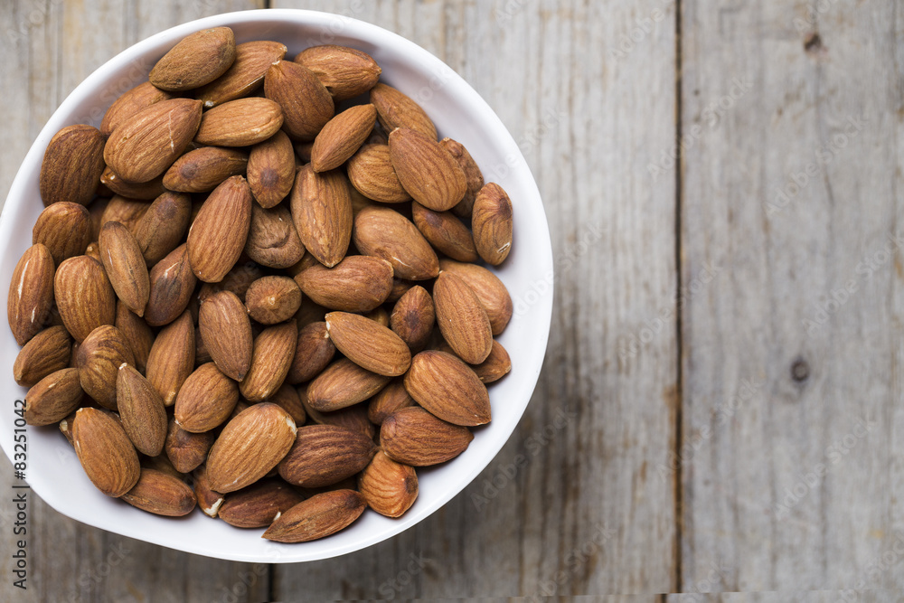 Almond nuts on wood background Almond nuts on wood background