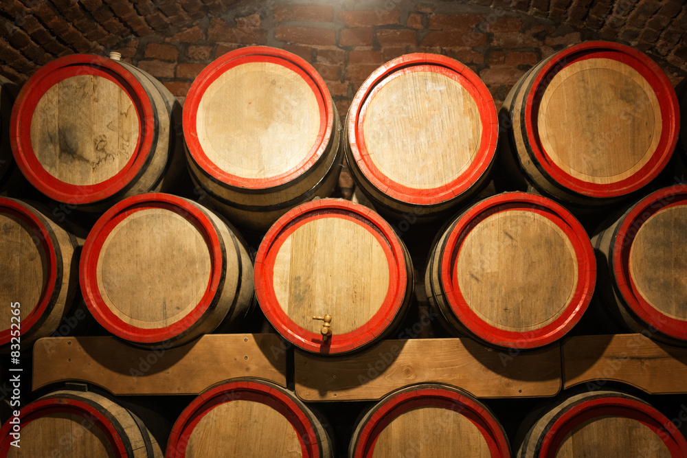 Wine barrels in the antique cellar. Cavernous wine cellar with Wine barrels in the antique cellar. Cavernous wine cellar with