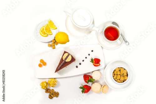 cake served with fresh fruits and tea