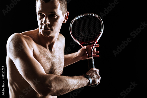  Tennis player on black background. Studio shot © fotofabrika