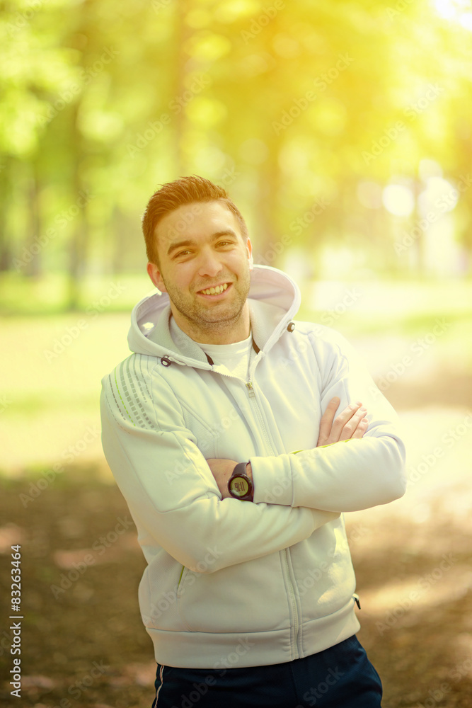 Portrait of handsome young sportsman in park Portrait of handsome young sportsman in park