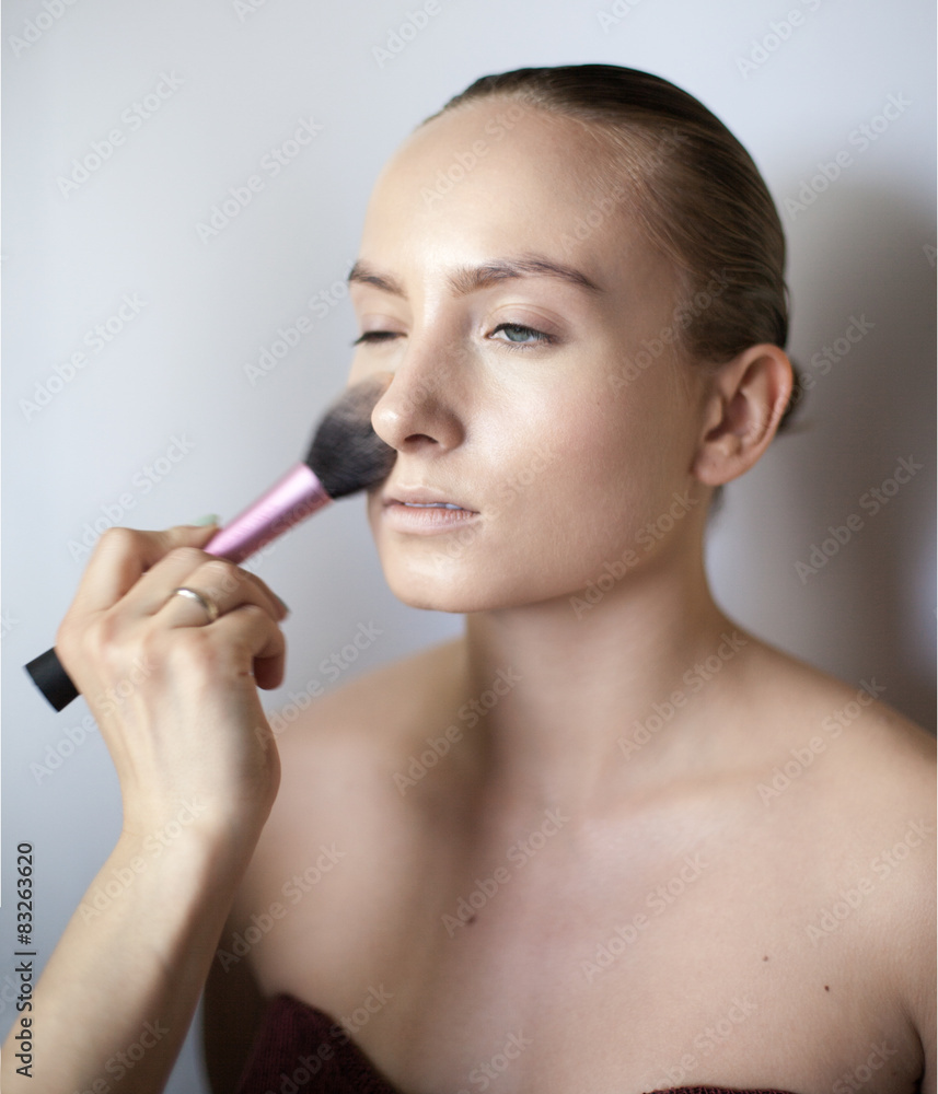 Makeup artist applies eye shadow. Beautiful woman face. Makeup artist applies eye shadow. Beautiful woman face.