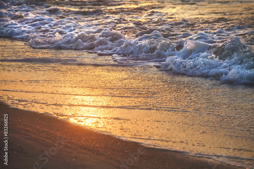 Sea wave on sandy beach