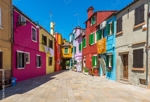 Street with colorful buildings in Burano island, Venice, Italy © Ekaterina Belova