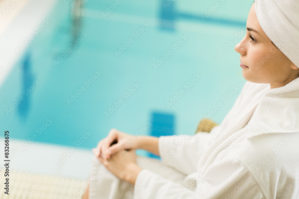 Fototapeta premium Young woman by the pool