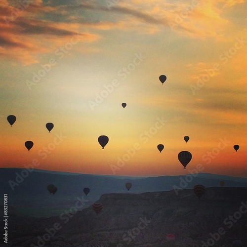 balloons over sunrise in cappadocia 