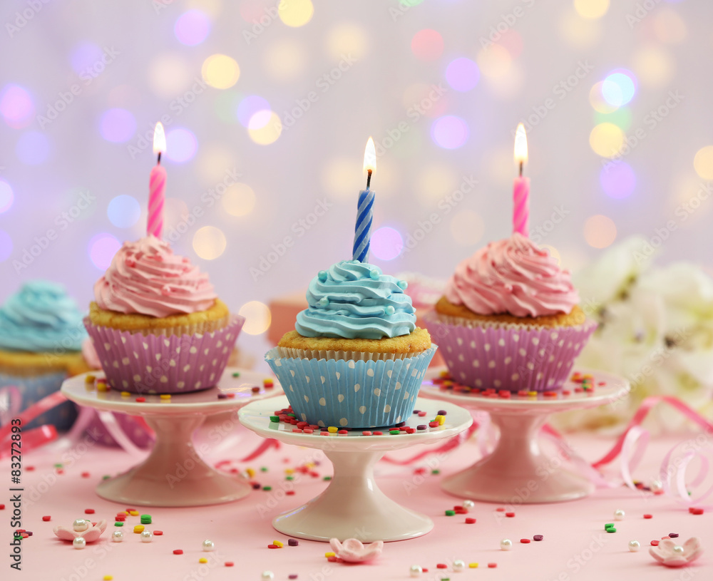 Delicious cupcakes on table on light background Delicious cupcakes on table on light background