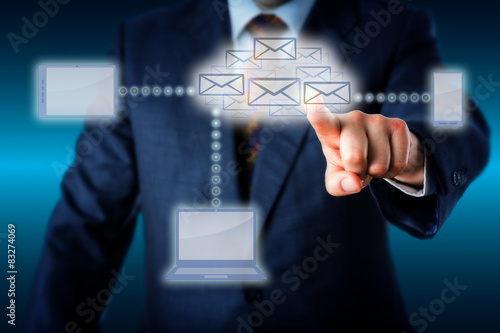 Bild auf Leinwand Manager Touching A Host Of Emails In Cloud Network