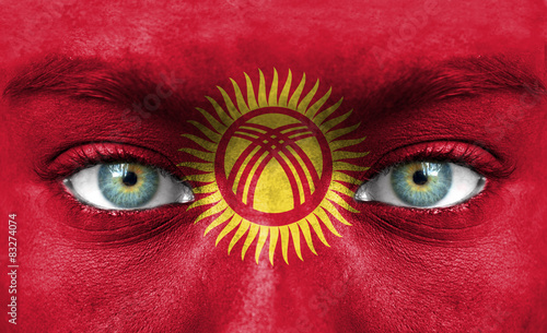 Human face painted with flag of Kyrgyzstan