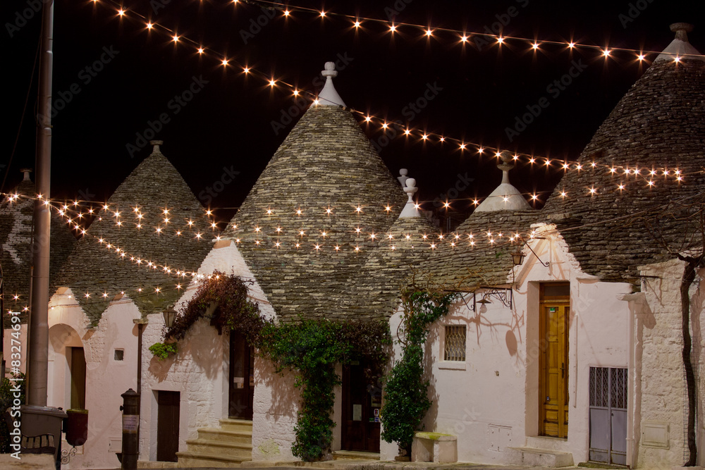 Alberobello trullo at night decorated with hundreds  lights
