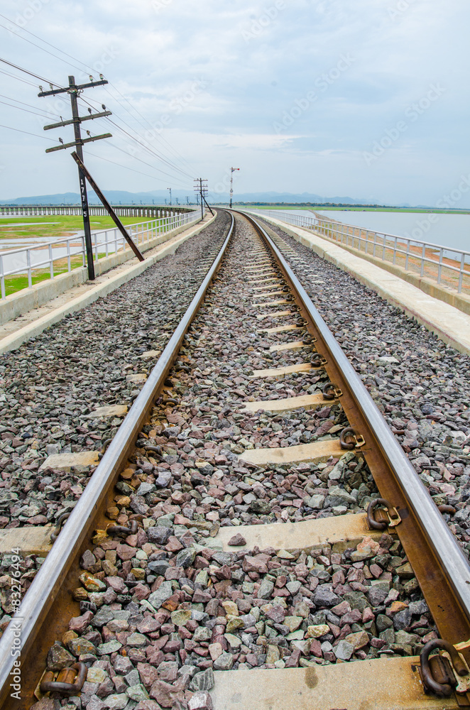 Railroad tracks into the reservoir, Lopburi Thailand. 