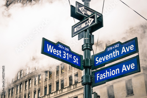 Modern street signs and urban vapor steam in New York City