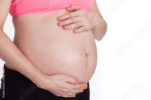 abdomen of pregnant with white background © suwanphoto