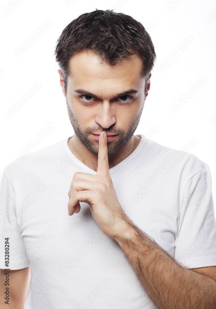 young man making silence gesture, shhhhh!! young man making silence gesture, shhhhh!!