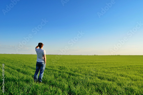 Man looks into the distance on the field