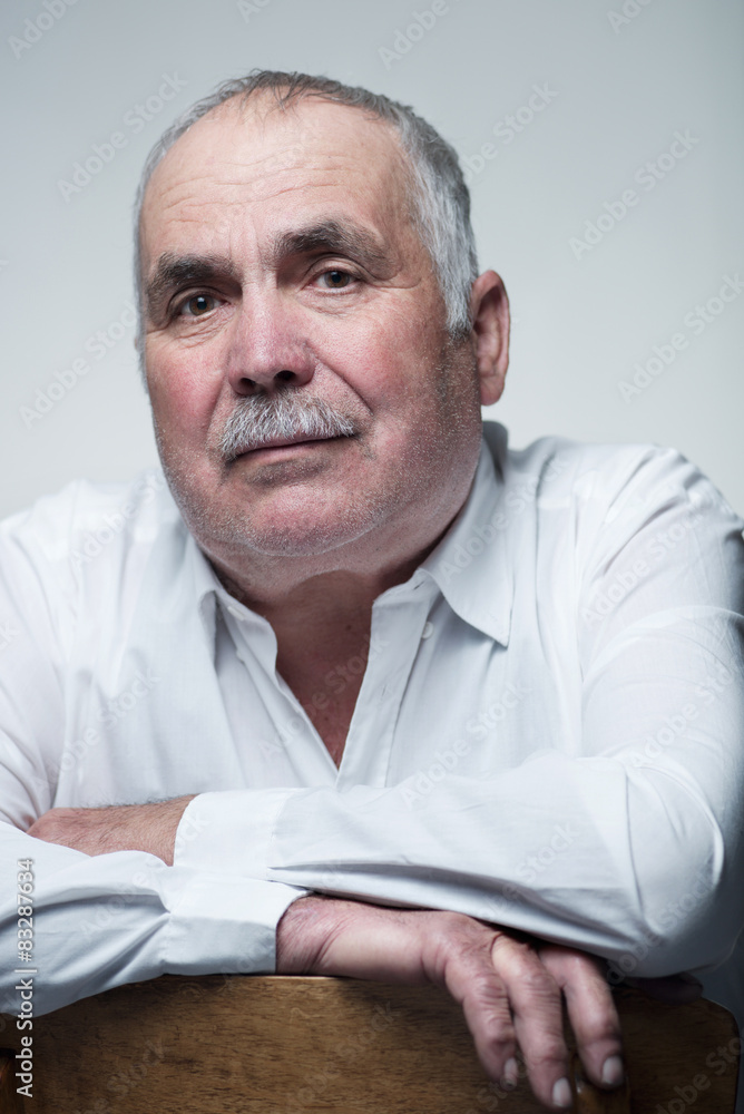 Close-up portrait of a Caucasian senior man with mustache Close-up portrait of a Caucasian senior man with mustache