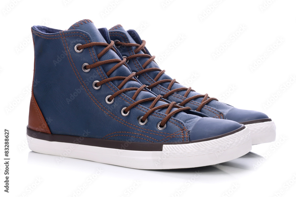 Pair of blue sneakers on a white background  - obrazy, fototapety, plakaty 