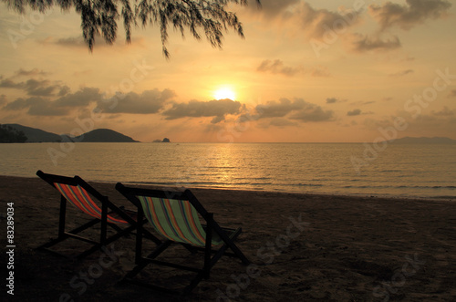 The Sunset view with couple beach chairs on the beach  © kosterz