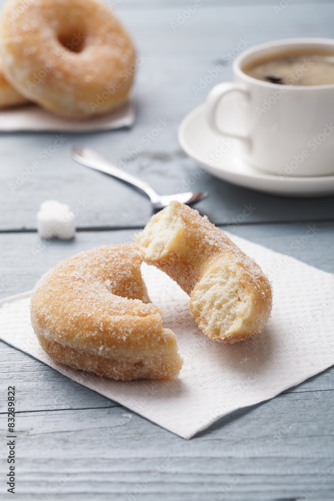 Fresh donut served with a cup of coffee Fresh donut served with a cup of coffee