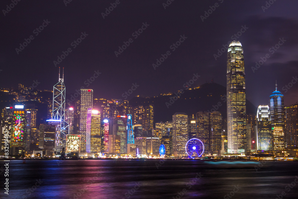 Fototapeta premium illuminated skyscrapers in victoria harbor,hongkong.
